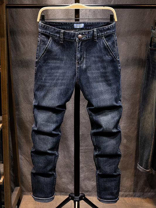 Blue jeans on a mannequin against a plain background